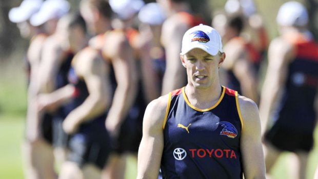 A standout: Crows star Nathan van Berlo hits the training track in Adelaide on Monday.