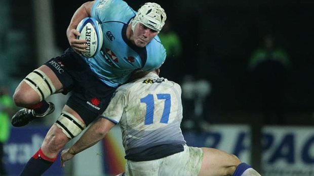 Kane and able ... the Waratahs' Kane Douglas forces his way past the Force on Saturday.