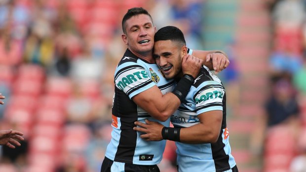 Four-try hero: Valentine Holmes, right, celebrates with Chris Heighington.