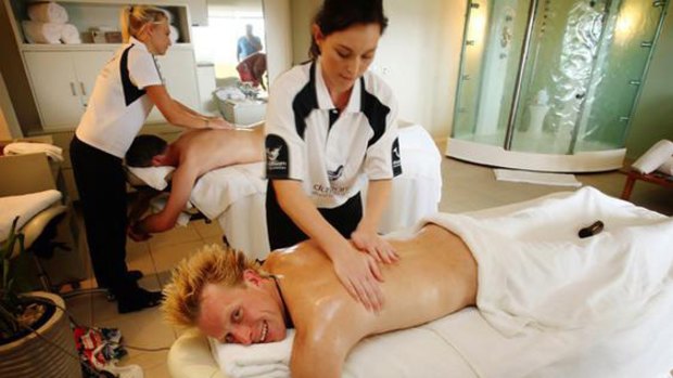"The Best Job in the World" competition winner Ben Southall of Britain receives a massage on Daydream Island.