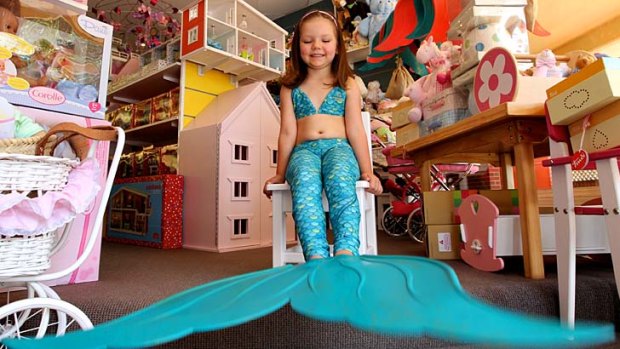 If the fin fits&#8230; Kira Delaney tries on a Merfin at Hopscotch Toys in Mosman.