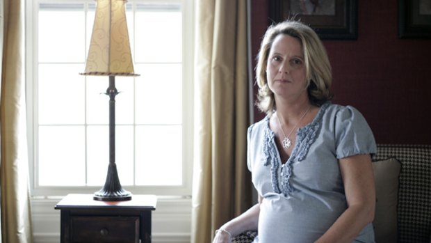 Carrying another couple's baby ... Carolyn Savage, 40, is seen at her home, in Sylvania, Ohio.