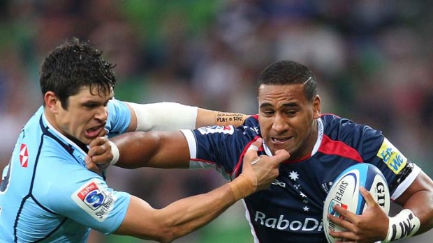 Have ball, will travel &#8230; Rebels winger Cooper Vuna takes on Tom Carter of the Waratahs in their clash in Melbourne this month.