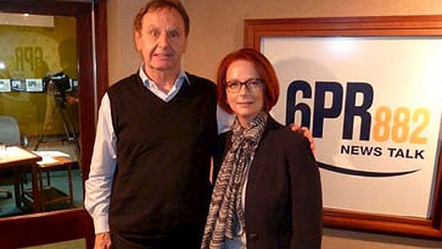 Stepping over the line: Howard Sattler poses with Julia Gillard after his bizarre interview on Thursday.