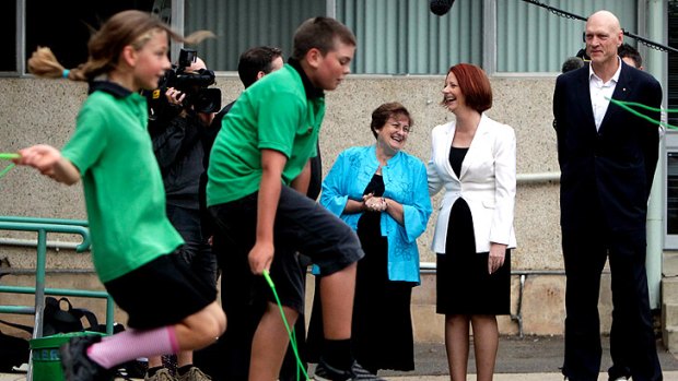 Green light for My School website launch: Julia Gillard and Peter Garrett speak to principal Jan Day at the Turner school in Canberra yesterday.