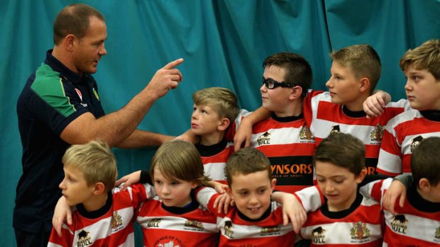 Kangaroos prop Matt Scott talks to local school children during a Rugby League clinic session at Belle Vue Stadium in Manchester.