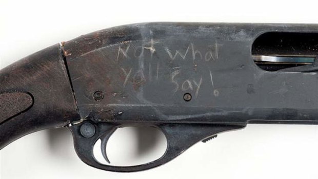 The shotgun Aaron Alexis used with an etching reading, "Not what yall say!".