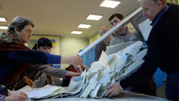Couting ballots at a polling station in Kiev.