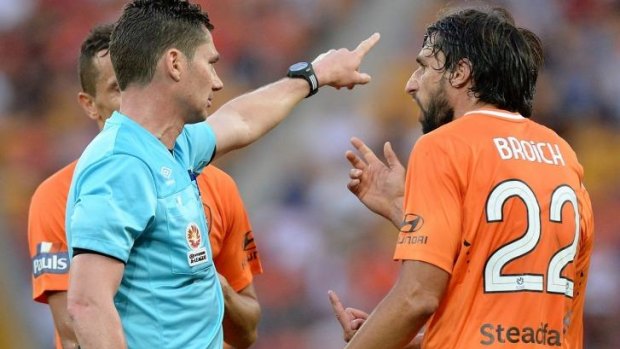 Brisbane Roar's Thomas Broich argues with the ref after Matt McKay was sent from the pitch.