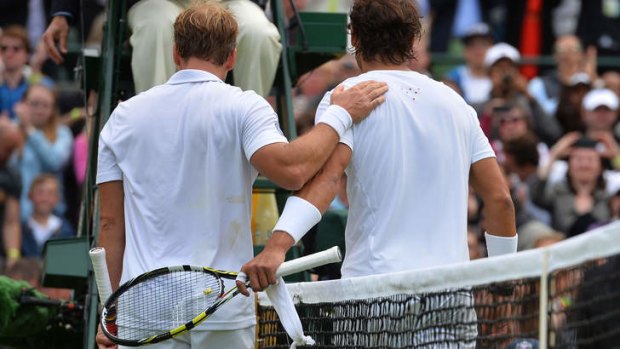Towelling: Rafael Nadal suffered a first-round defeat to Belgium's Steve Darcis at Wimbledon.