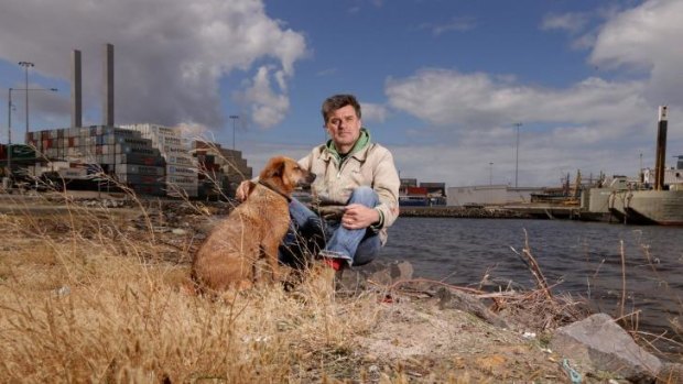 Finding beauty in bleakness: Dave Bowers at one of his favourite places, a tiny beach at Docklands.