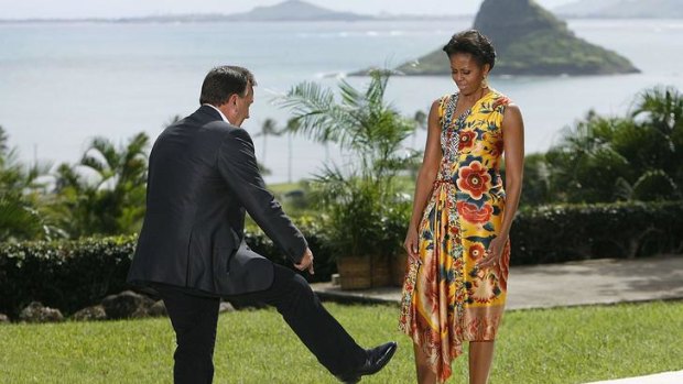 Tim Mathieson shows Michelle Obama his cowboy boots.