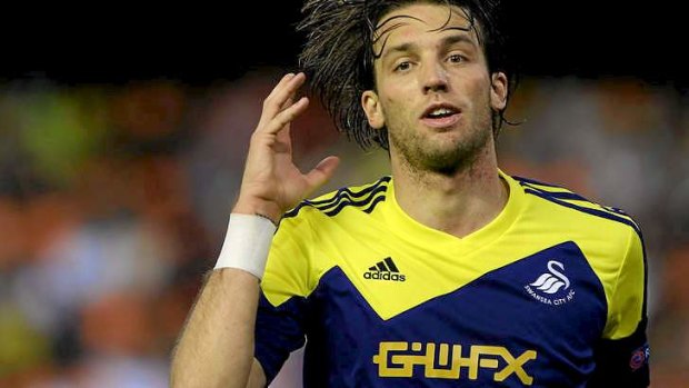 Miguel Michu celebrates after scoring For Swansea.