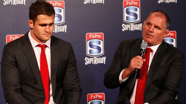 "We are out to win the title ... not to defend it" ... Ewen McKenzie, Reds coach, with James Horwill.