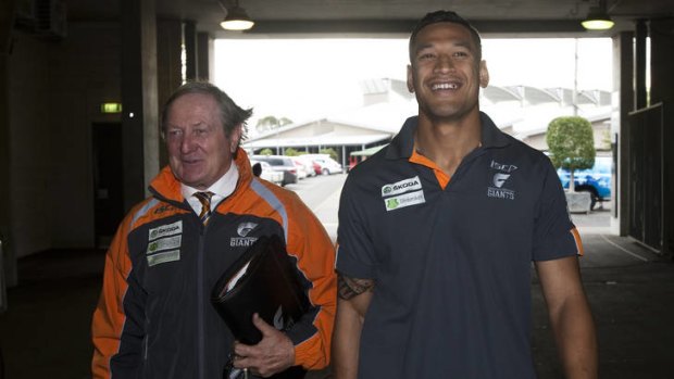 Greater Western Sydney Giants head coach Kevin Sheedy speaks to Israel Folau before before his retirement from AFL.