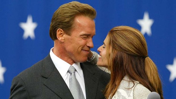 New paths ... Arnold Schwarzenegger kisses his wife, Maria Shriver, after being sworn in as governor.