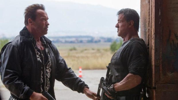 Arnold Schwarzenegger, left, and Sylvester Stallone in <i>The Expendables 3</i>.