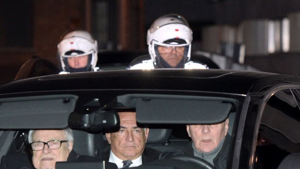 Dominique Strauss-Kahn, centre, and his lawyer Henri Leclerc, left, on their way to court. 
