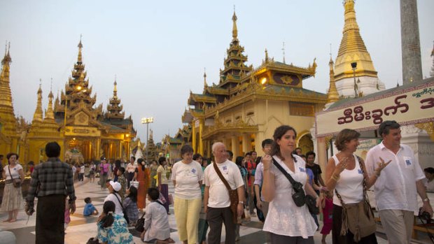 Flocking in: Foreigners tour the Schwedagon Pagoda in Yangon.