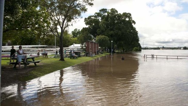 Flood warning ... sightseers gather at the Prince Street wharf in Grafton where official readings are taken.