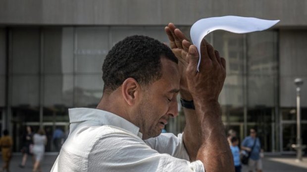 Kevin Martin becomes emotional as he leaves the Washington DC courthouse on Monday after being exonerated for a crime he did not commit.