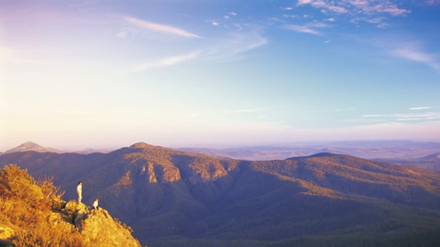 Rock hopping ... bushwalkers at the Sawn rocks in Mount Kaputar National Park.