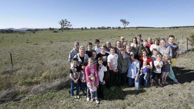 Uriarra village residents in front of the proposed site for a solar farm across the road to Uriarra Village.