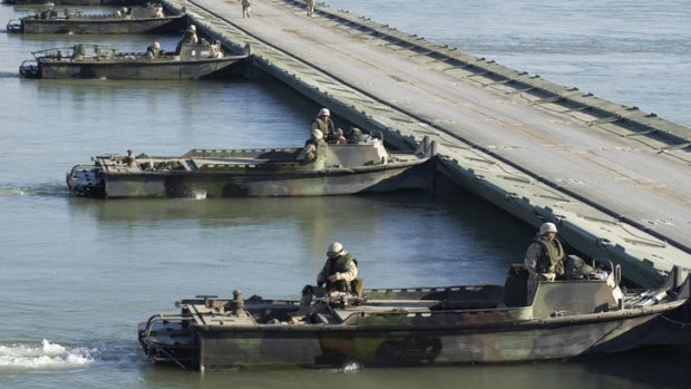 Bridge building boats in action during the war in Iraq.