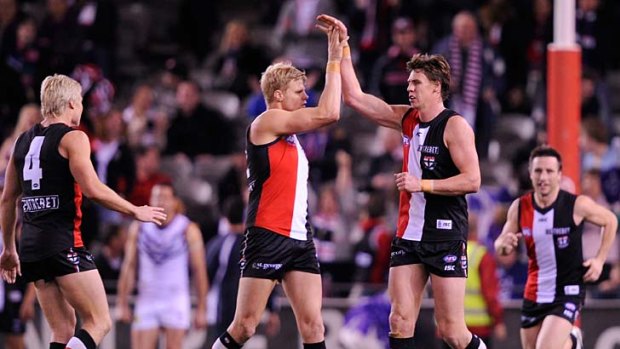Justin Koschitzke celebrates a goal with Nick Riewoldt during the game against Fremantle.