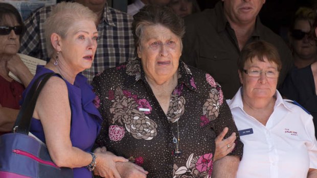 Jean Bischoff (front and second from left) with family members after the Funeral for Noelene and Yvana Bischoff in Gatton Baptist Church In Queensland.