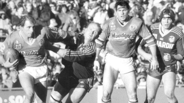 Back in the day: Jay Hoffman carts the ball up for the Canberra Raiders against Parramatta in 1985, fending off the one and only Stan Jurd in the process.