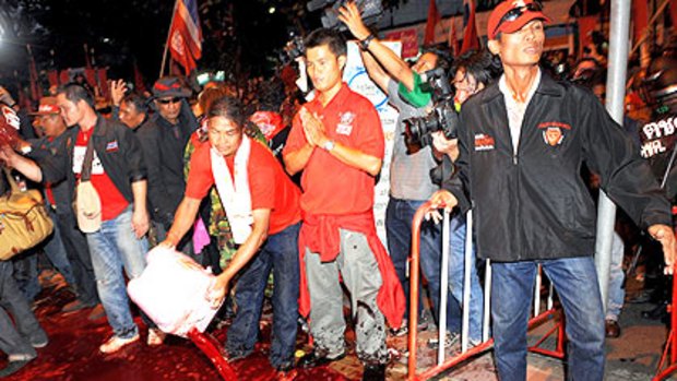 Protesters splash human blood outside Government House.