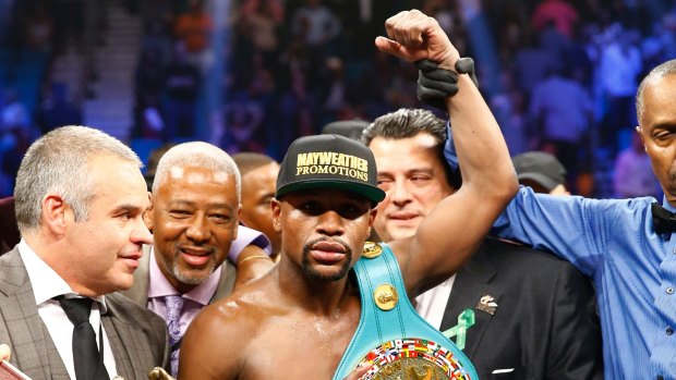 Unanimous: Floyd Mayweather jnr celebrates his win over Manny Pacquaio.