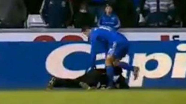 Chelsea player Eden Hazard pulls his foot back before kicking out at a ballboy.