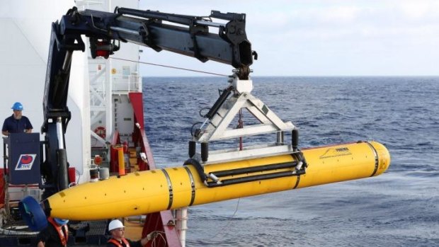 Technical difficulties ... the Bluefin-21 is craned over the side of Australian Navy vessel Ocean Shield in the search for missing Malaysia Airlines Flight MH370.