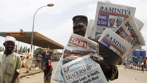 Good luck ... a man sells local newspapers with election headlines in Kaduna, Nigeria.