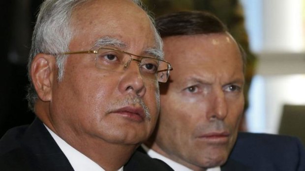 Malaysia's Prime Minister Najib Razak and Australia's Prime Minister Tony Abbott tour the RAAF Pearce base near Perth on Thursday.