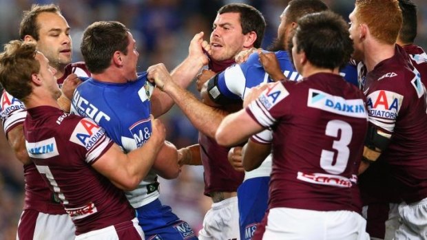 Josh Jackson of the Bulldogs and Josh Starling of the Sea Eagles clash after the alleged chicken wing tackle.