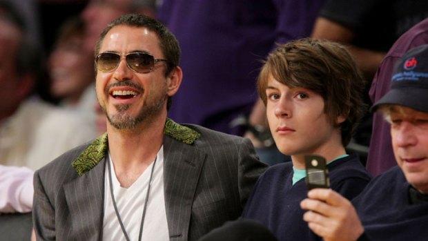 Robert Downey Jr with his son Indio at a basketball game in 2008.