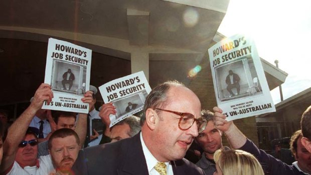 Peter Reith is confronted by Maritime Union members in 1998.