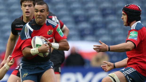 Dragged down: Simon Zebo of Munster is nabbed by the Edinburghdefence.