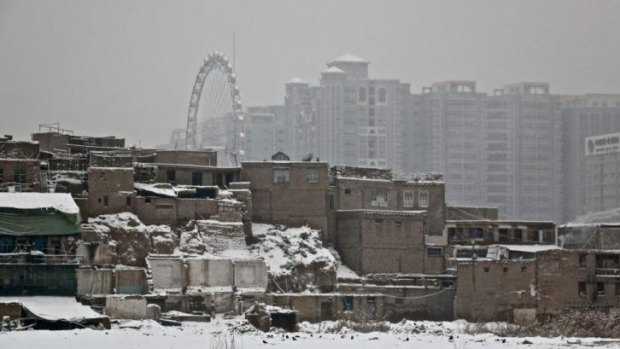'Assimilation on steroids': Kashgar's old town (foreground) make's way for high-rises as part of China's policy to make the town a special economic zone.