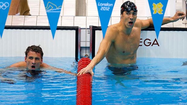 Another record ... gold medallist Michael Phelps, right, with silver medallist Ryan Lochte after the race.
