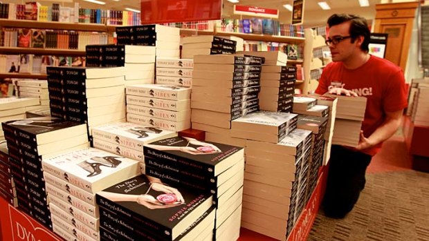 Grey area &#8230; Dymocks's Jack Bayfield loads up a display with books the retailer believes will appeal to Fifty Shades fans.