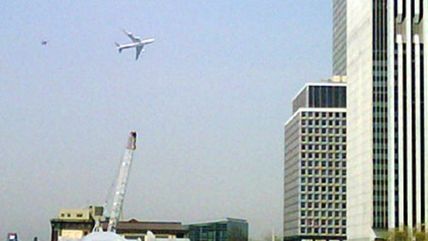 The primary presidential aircraft, a Boeing 747 known as Air Force One when the president is aboard, flies low over New York Harbour, followed by an F-16 chase plane during a Federal Government photo op on April 27.