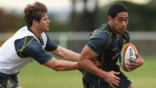 Keen to go: Joseph Tomane is tackled during a Wallabies training session in Sydney this month.