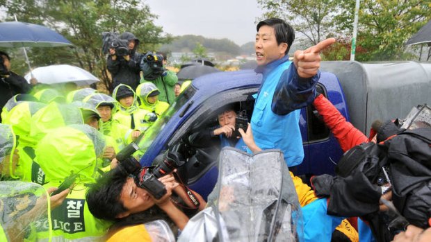 Stand-off ... police block Park Sang-Hak's truck containing anti-North Korea leaflets in Paju, north of Seoul.