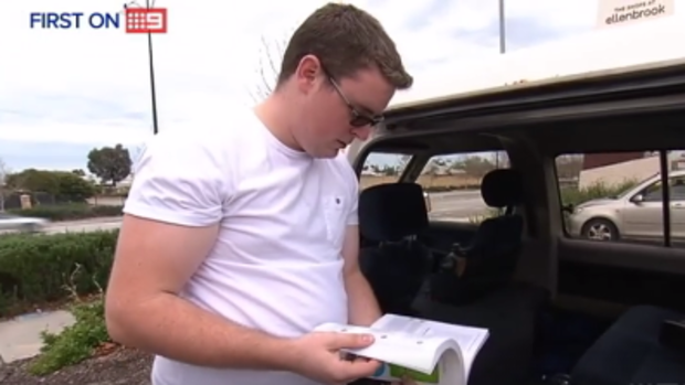 Good Samaritan Adam Fry examines his van which was broken into while he was helping injured motorcyclists.