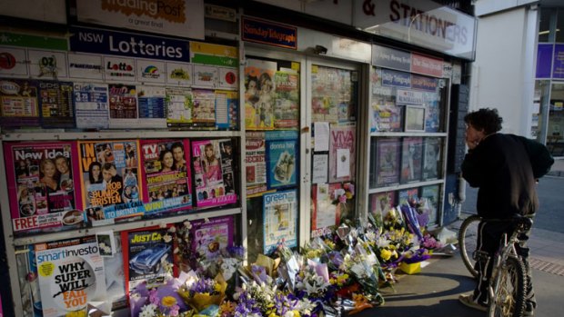 Tributes for the Lin family left at the newsagency.