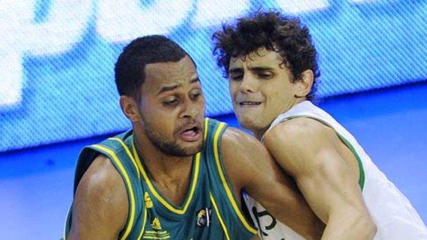 Point guard Patrick Mills tries to dribble past Raul Neto of Brazil.